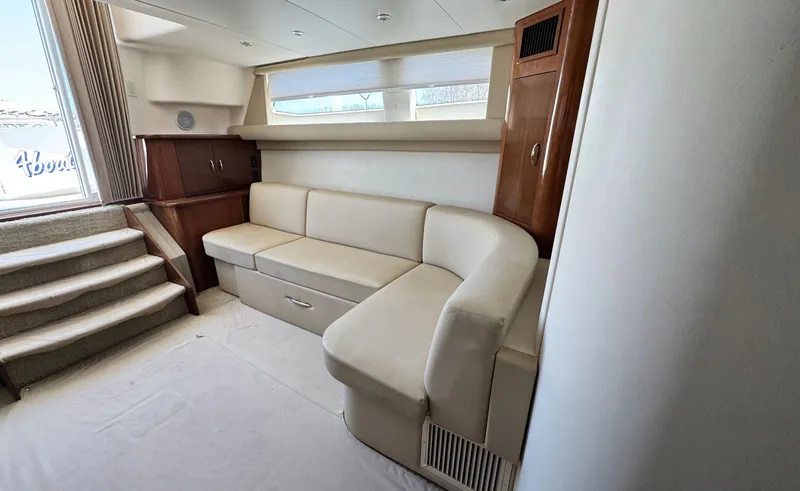 Slide: The Image of Interior of 2008 Carver 36 Mariner yacht with beige seating and wooden accents. - 32