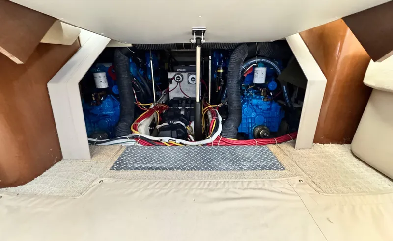 Slide: The Image of Engine compartment of a 2008 Carver 36 Mariner with visible wiring and components. - 33