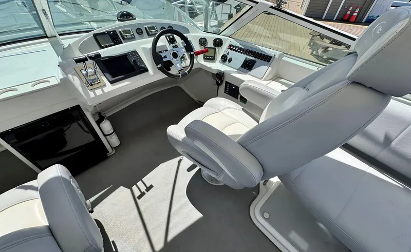 Slide: The Image of 2008 Carver 36 Mariner helm with modern controls and comfortable seating. - 36