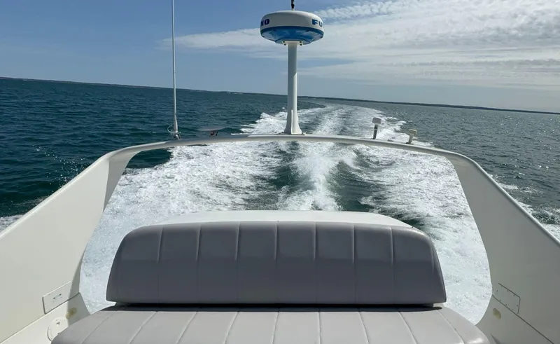 Slide: The Image of 2008 Carver 36 Mariner cruising on open water, leaving a wake behind. - 45