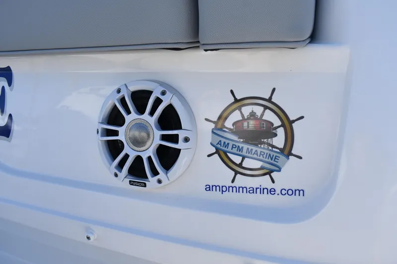 Slide: The Image of 2023 Regal 36 XO boat with speaker and AM PM Marine logo. - 12