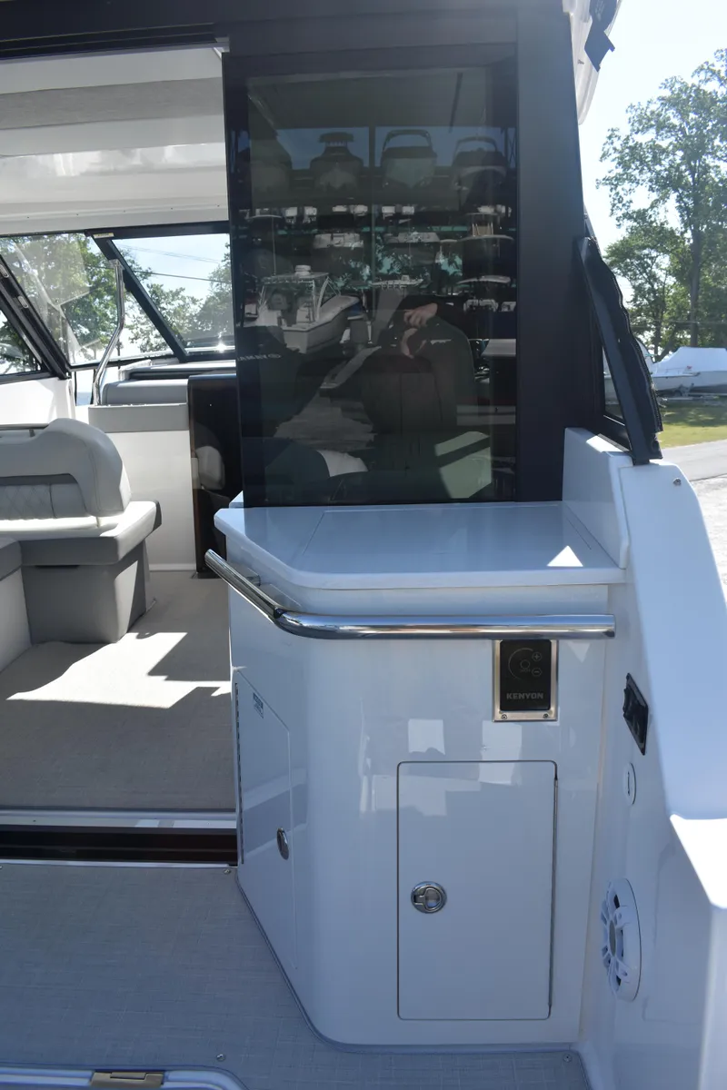 Slide: The Image of 2023 Regal 36 XO yacht interior with seating and modern amenities. - 18