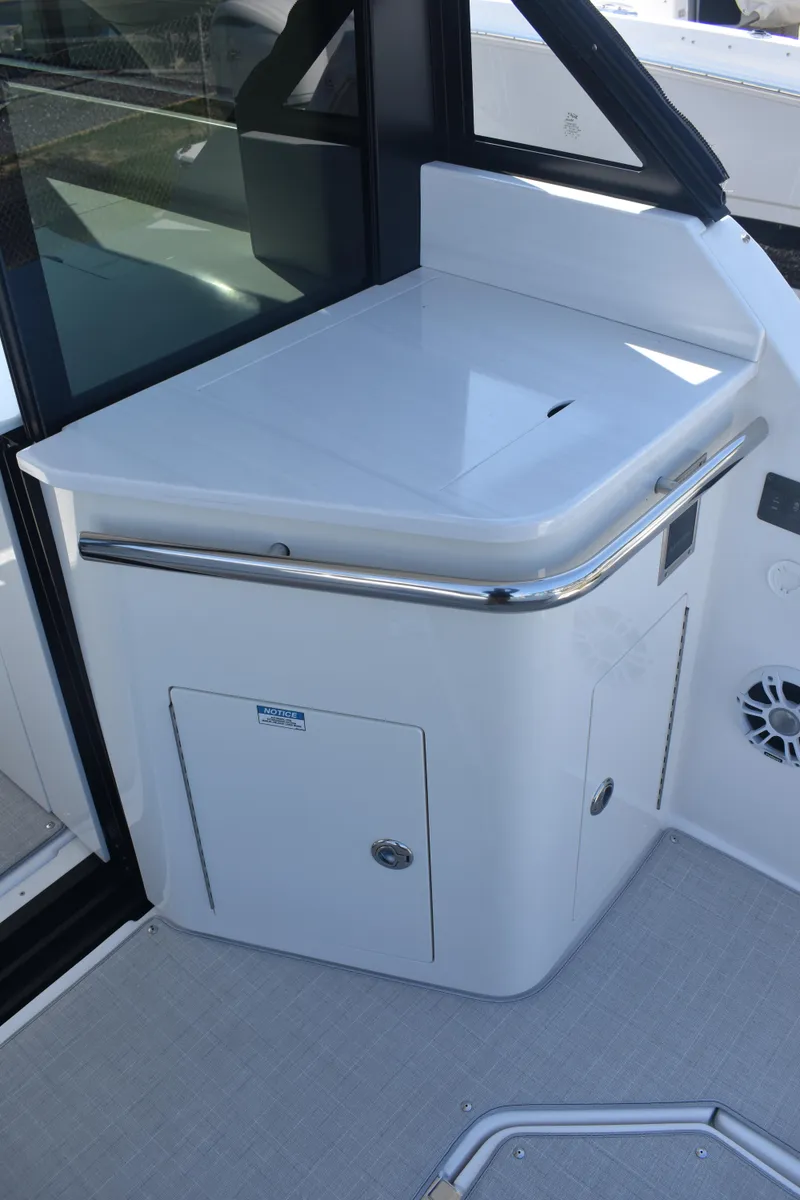 Slide: The Image of 2023 Regal 36 XO yacht interior detail with sleek white cabinetry and modern design. - 27