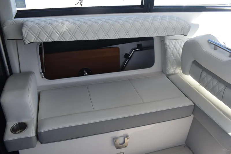 Slide: The Image of Luxurious seating area in 2023 Regal 36 XO boat with quilted upholstery. - 37