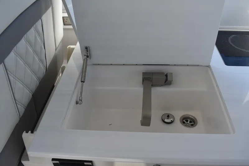 Slide: The Image of 2023 Regal 36 XO yacht sink with modern faucet and sleek design. - 43