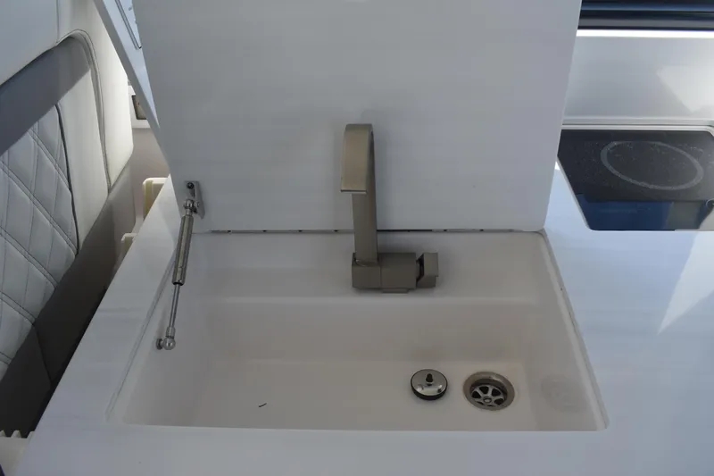 Slide: The Image of Modern sink and faucet on 2023 Regal 36 XO yacht interior. - 44