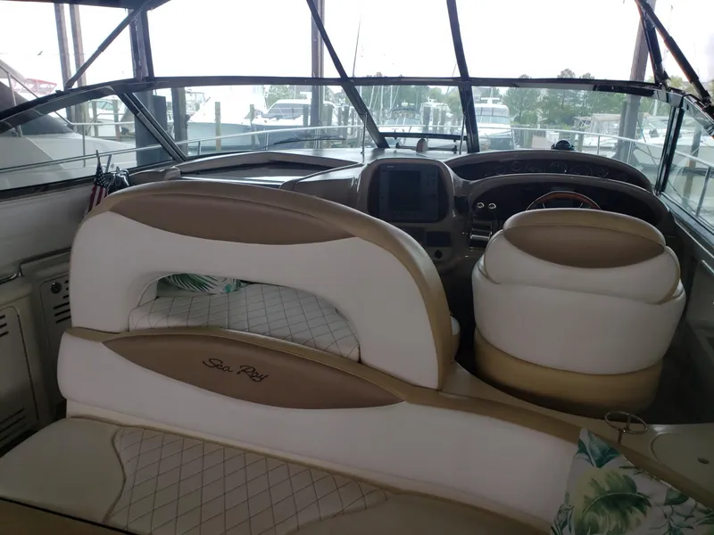 Slide: The Image of Interior view of 2001 Sea Ray 410 Sundancer boat with beige and white seating. - 10
