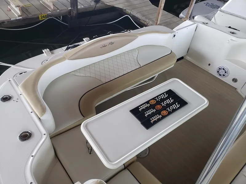 Slide: The Image of 2001 Sea Ray 410 Sundancer boat interior with seating and table. - 11