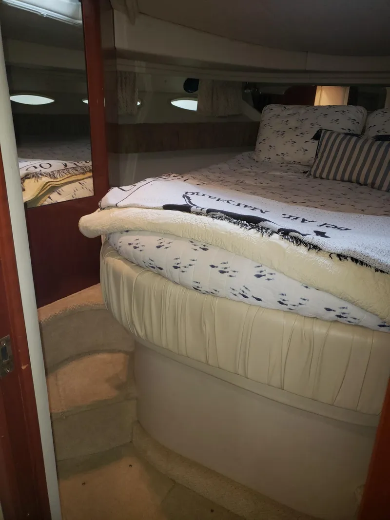 Slide: The Image of 2001 Sea Ray 410 Sundancer cabin with cozy bed and steps. - 21