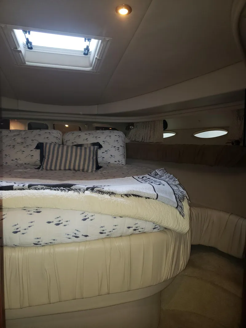 Slide: The Image of 2001 Sea Ray 410 Sundancer cabin with cozy bed and skylight. - 22