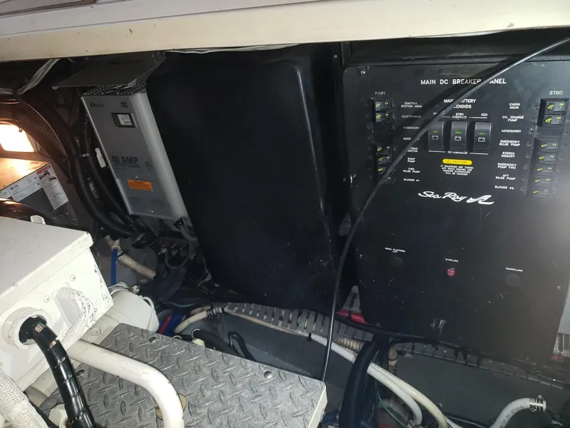 Slide: The Image of Electrical panel and components inside a 2001 Sea Ray 410 Sundancer boat. - 34