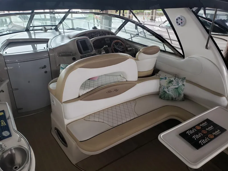 Slide: The Image of Interior of 2001 Sea Ray 410 Sundancer yacht with plush seating and modern helm. - 6