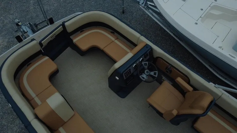 Slide: The Image of 2025 Tahoe Pontoon Aura 2185 Quad Lounger Triple, spacious interior with luxurious seating. - 2