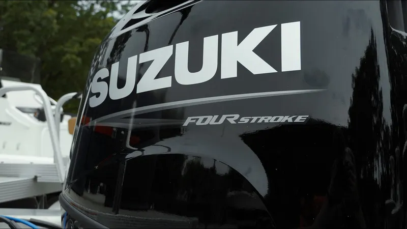 Slide: The Image of Suzuki four-stroke engine on 2025 Tahoe Pontoon Aura 2185 Quad Lounger Triple. - 21