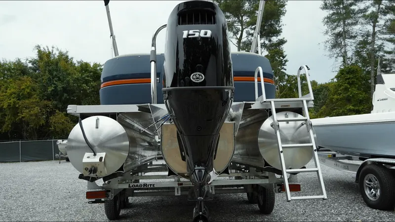 Slide: The Image of 2025 Tahoe Pontoon Aura 2185 Quad Lounger Triple with 150 HP engine, rear view. - 23