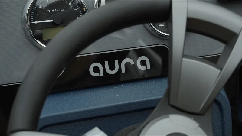 Slide: The Image of Steering wheel and dashboard of 2025 Tahoe Pontoon Aura 2185 Quad Lounger Triple. - 3