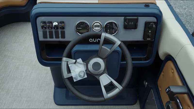 Slide: The Image of Steering console of 2025 Tahoe Pontoon Aura 2185 Quad Lounger Triple with modern controls. - 4