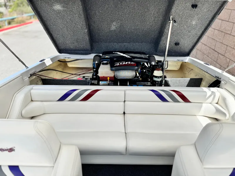 Slide: The Image of 2005 Eliminator Eagle 230 XP boat interior with open engine compartment. - 15