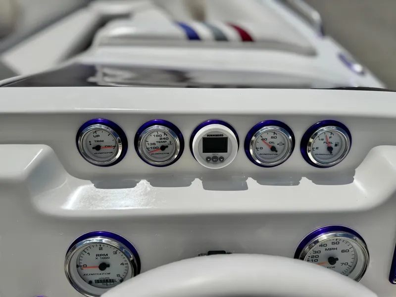 Slide: The Image of Dashboard of 2005 Eliminator Eagle 230 XP boat with gauges and controls. - 22