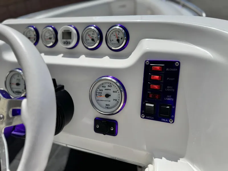 Slide: The Image of Dashboard of 2005 Eliminator Eagle 230 XP boat with gauges and switches. - 23