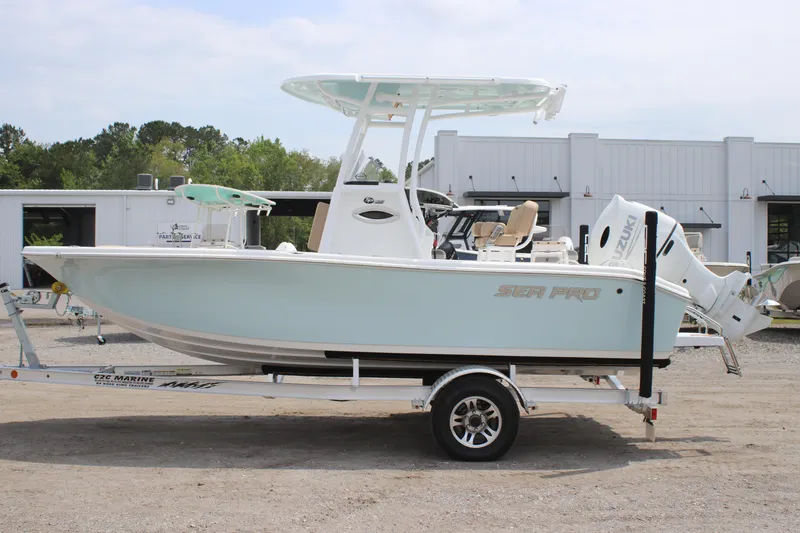Slide: The Image of 2025 Sea Pro 202 CC boat on trailer, parked outdoors. - 10