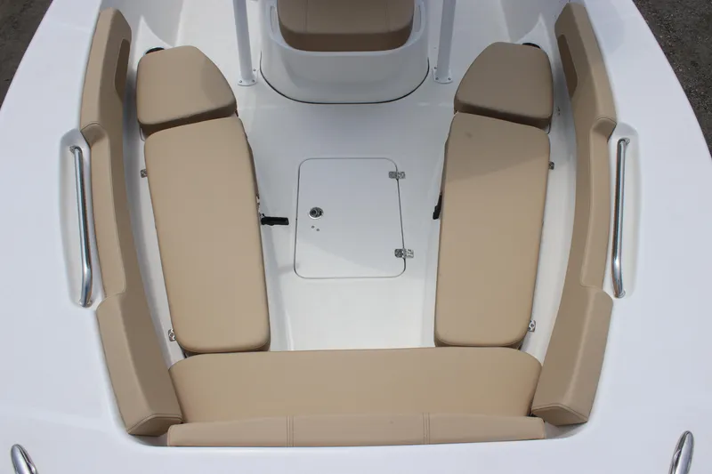 Slide: The Image of 2025 Sea Pro 202 CC boat interior with beige cushioned seating and storage hatch. - 14