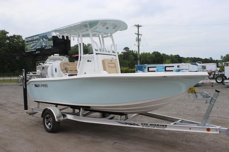 Slide: The Image of 2025 Sea Pro 202 CC boat on trailer, displayed outdoors. - 2