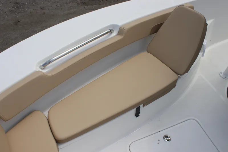 Slide: The Image of 2025 Sea Pro 202 CC boat interior with beige cushioned seating. - 21