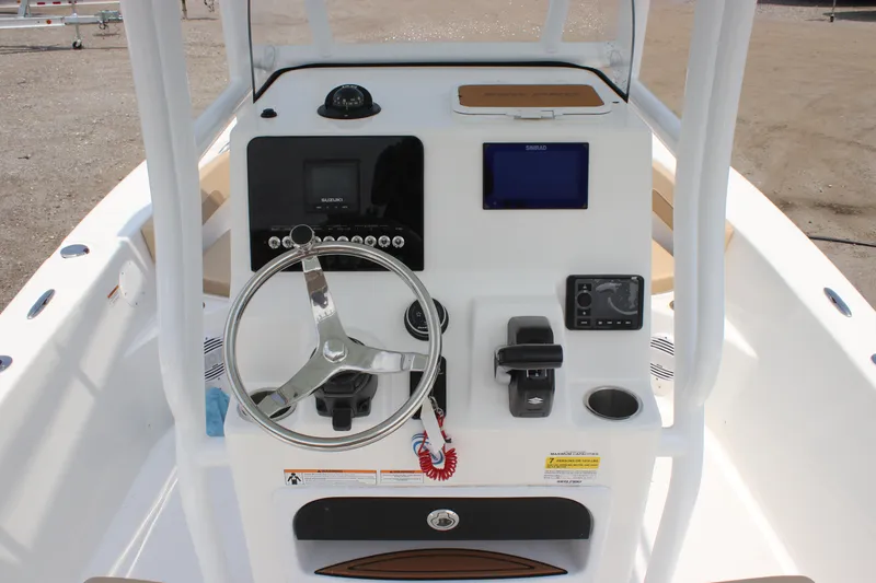 Slide: The Image of 2025 Sea Pro 202 CC boat console with steering wheel and navigation controls. - 26