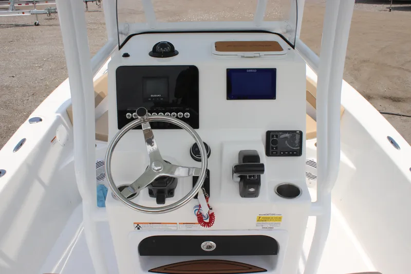 Slide: The Image of 2025 Sea Pro 202 CC boat console with steering wheel and navigation controls. - 27