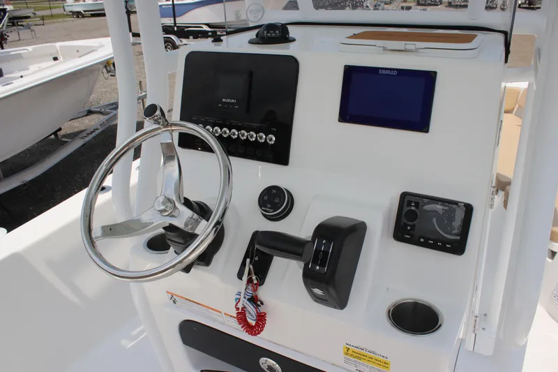 Slide: The Image of 2025 Sea Pro 202 CC boat console with steering wheel and navigation controls. - 28
