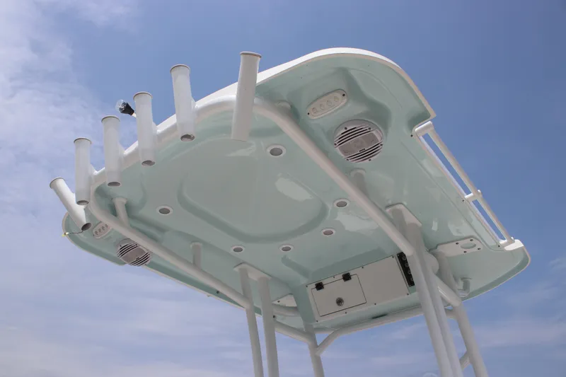 Slide: The Image of T-top of 2025 Sea Pro 202 CC boat against a clear blue sky. - 31