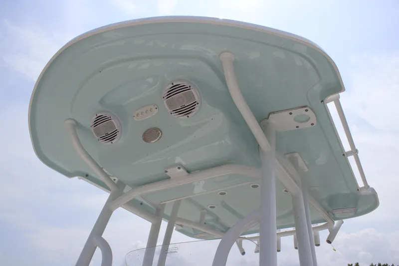 Slide: The Image of 2025 Sea Pro 202 CC boat T-top with integrated speakers and lighting. - 32