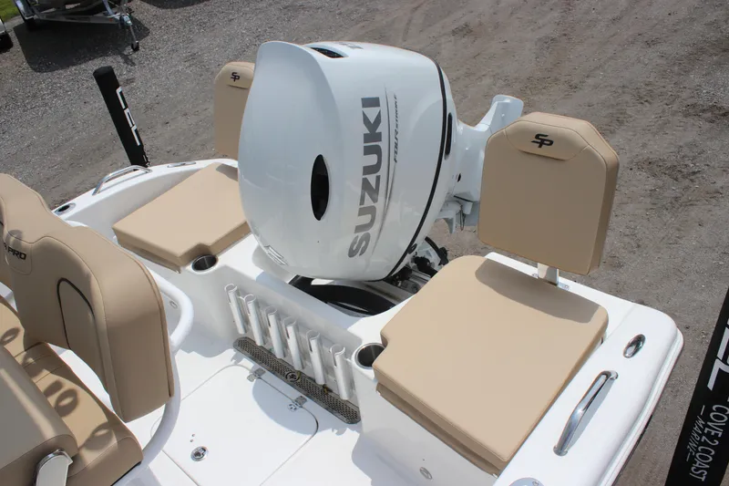 Slide: The Image of 2025 Sea Pro 202 CC boat with Suzuki outboard motor and beige seating. - 33