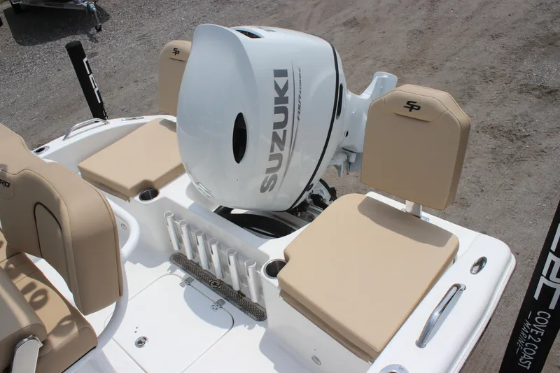 Slide: The Image of 2025 Sea Pro 202 CC boat with Suzuki outboard motor and beige seating. - 34