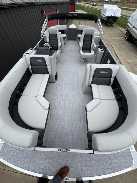 Slide: The Image of 2025 Harris Cruiser 210 pontoon boat with spacious seating and modern design. - 4