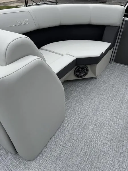 Slide: The Image of 2025 Harris Cruiser 210 boat interior with gray seating and flooring. - 5