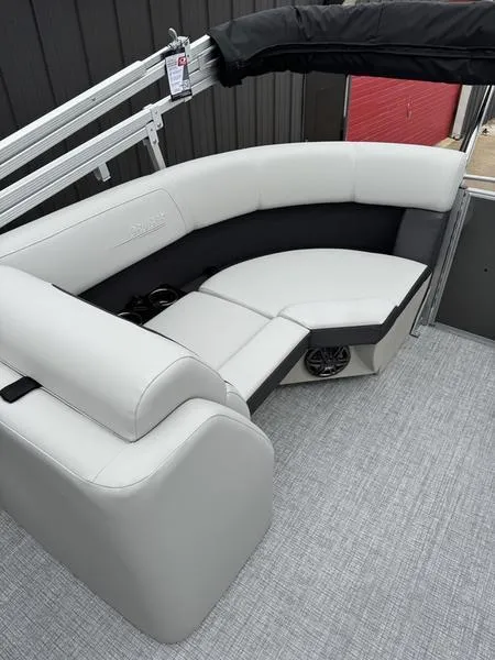 Slide: The Image of 2025 Harris Cruiser 210 boat interior with sleek white seating and modern design. - 6