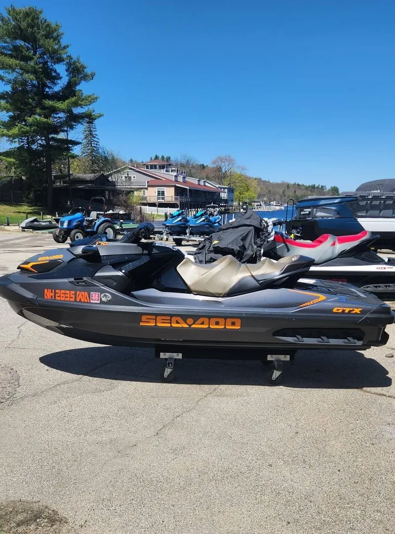 Slide: The Image of 2023 Sea-Doo GTX 170 SS iDF jet ski parked outdoors on a sunny day. - 1