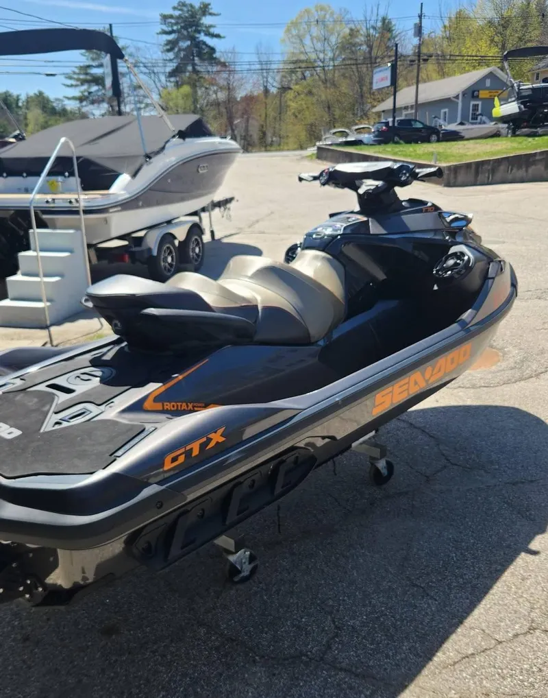 Slide: The Image of 2023 Sea-Doo GTX 170 SS iDF jet ski parked outdoors. - 3
