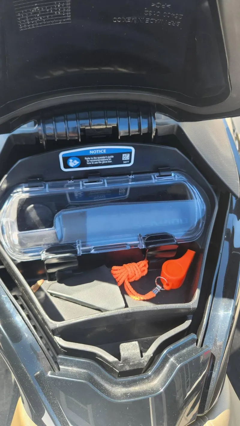 Slide: The Image of 2023 Sea-Doo GTX 170 SS iDF storage compartment with safety equipment and accessories. - 8