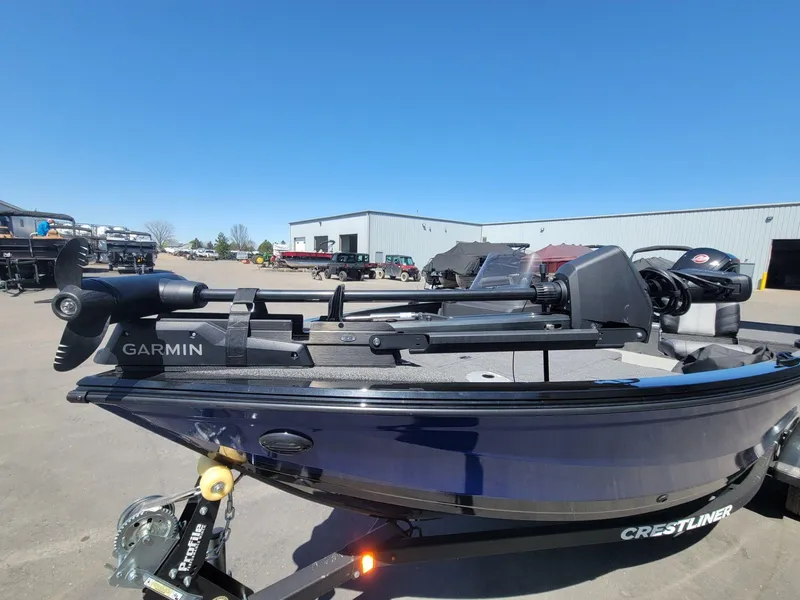 Slide: The Image of 2023 Crestliner 1750 Fish Hawk SE SC boat with Garmin equipment, parked outdoors. - 14