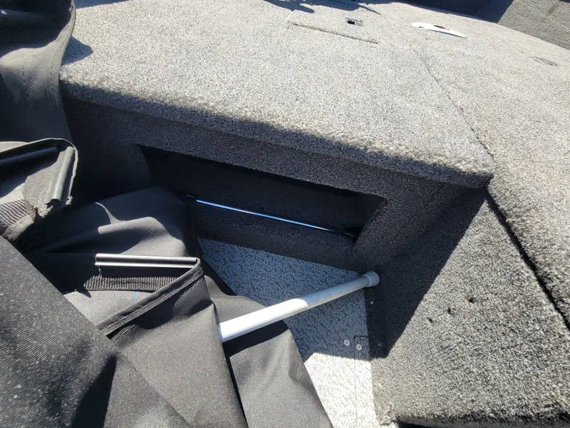 Slide: The Image of Interior of 2023 Crestliner 1750 Fish Hawk SE SC boat, showing storage compartment. - 24