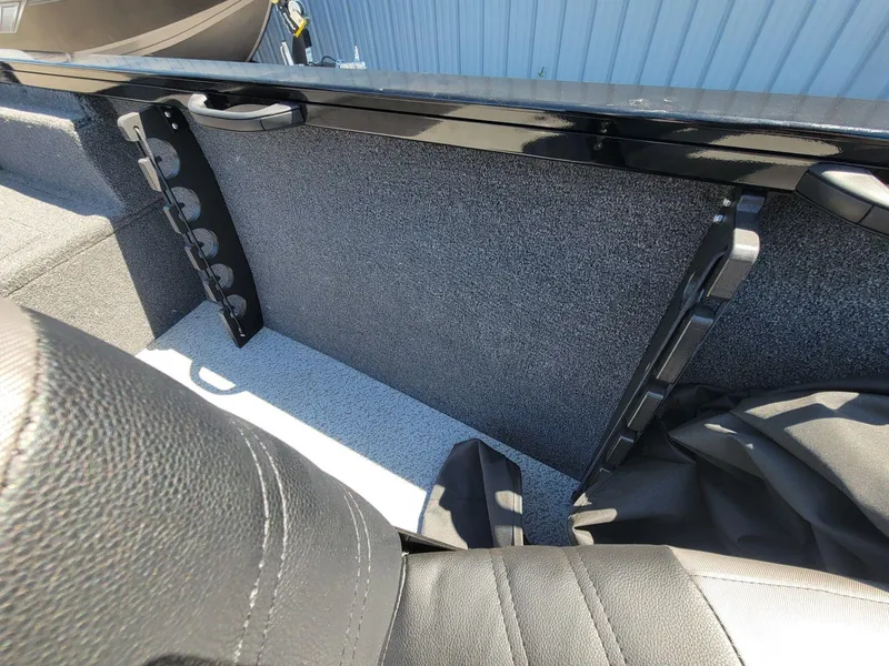 Slide: The Image of Interior view of 2023 Crestliner 1750 Fish Hawk SE SC boat, featuring seating and storage. - 25