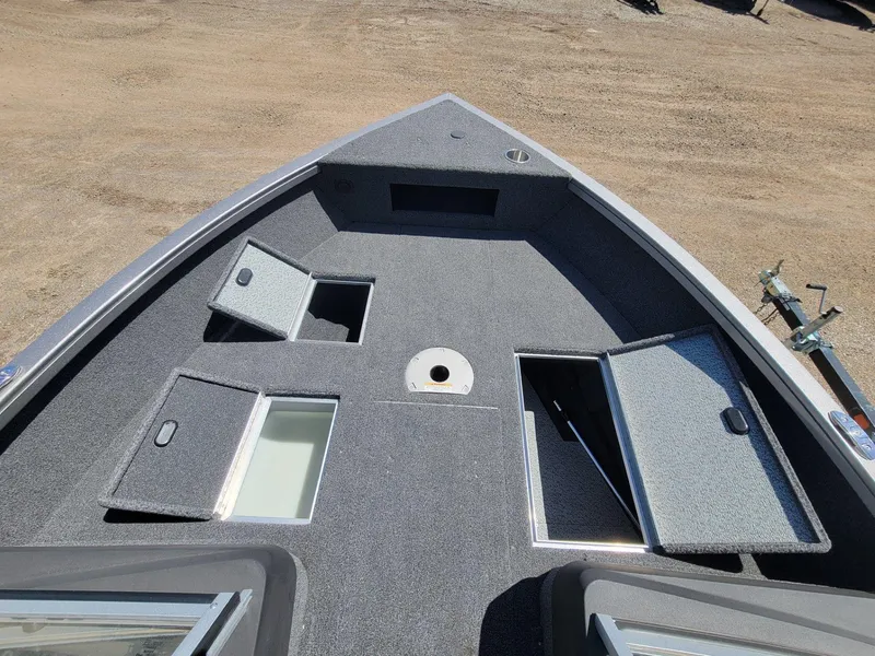 Slide: The Image of 2023 Crestliner 1750 Fish Hawk SE WT boat deck with storage compartments open. - 13