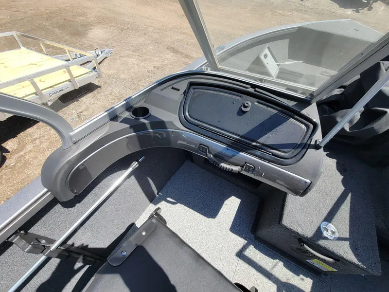 Slide: The Image of 2023 Crestliner 1750 Fish Hawk SE WT boat interior with storage compartment and seating. - 15