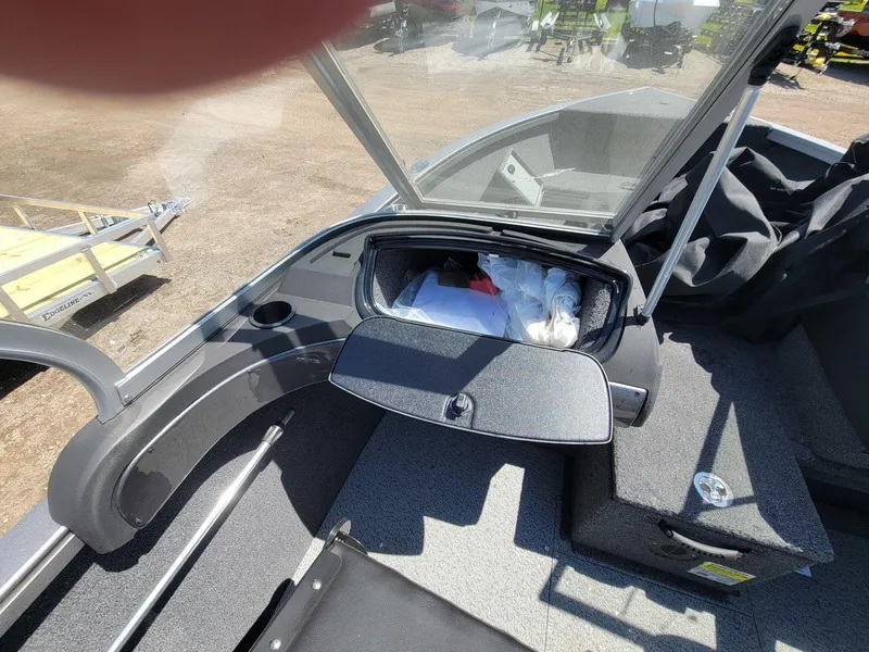 Slide: The Image of 2023 Crestliner 1750 Fish Hawk SE WT boat interior with open storage compartment. - 16