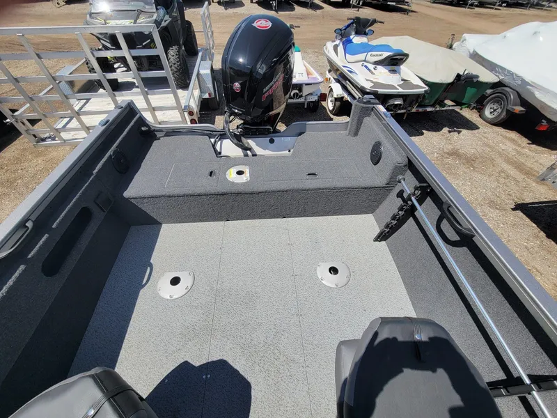 Slide: The Image of 2023 Crestliner 1750 Fish Hawk SE WT boat interior with motor, seats, and storage. - 17