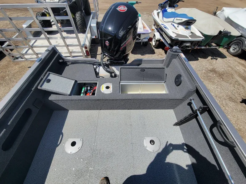 Slide: The Image of 2023 Crestliner 1750 Fish Hawk SE WT boat interior with motor and storage compartments. - 18