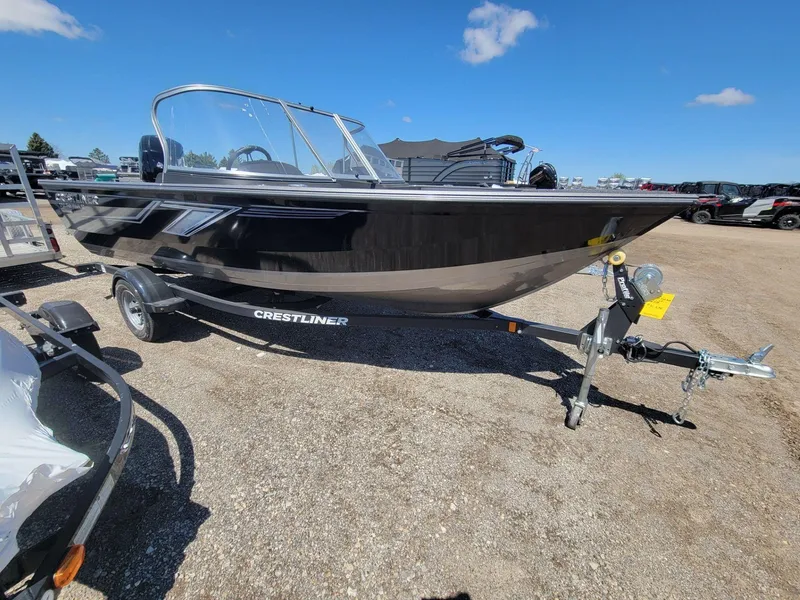 Slide: The Image of 2023 Crestliner 1750 Fish Hawk SE WT boat on trailer under clear blue sky. - 5